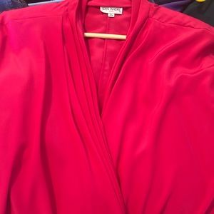 This blouse in a nice shade of pink and will add a dressy touch to one’s outfit.